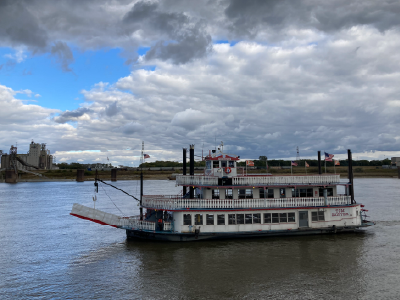 Tom Sawyer Riverboat on the Mississippi River with clouds in the background