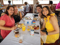 A group of four women eating on a Brunch Cruise aboard the Riverboats at the Gateway Arch.